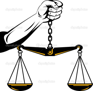 Hand Holding Scales of Justice