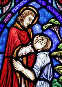 Stained glass window shows Jesus healing blind man